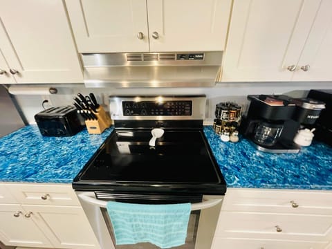 Kitchen includes Keurig Duo coffee maker, sugar, spice  rack, toaster, oil& more