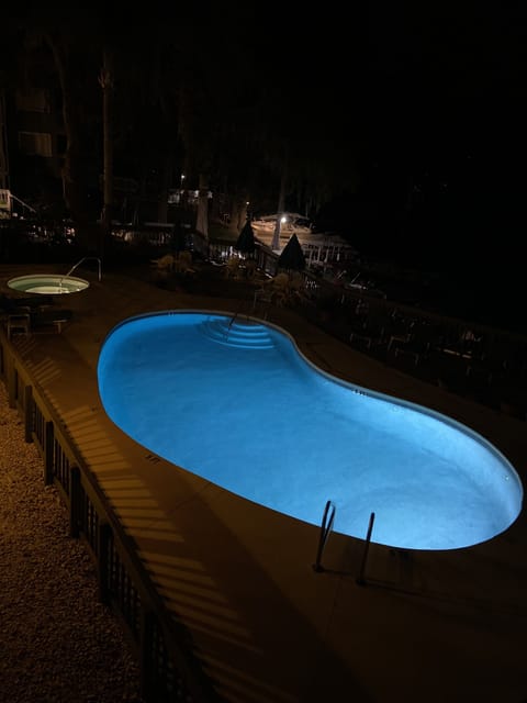 Pool and Hot tub at night.  View from our balcony. 