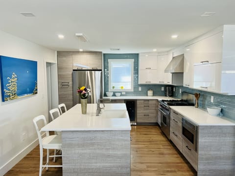 Welcome!
A modern Chef’s kitchen with Fisher Paykal appliances and Wolf oven.  
