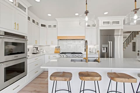Welcome to the heart of our inviting home—a kitchen island that effortlessly combines functionality with a welcoming ambiance.