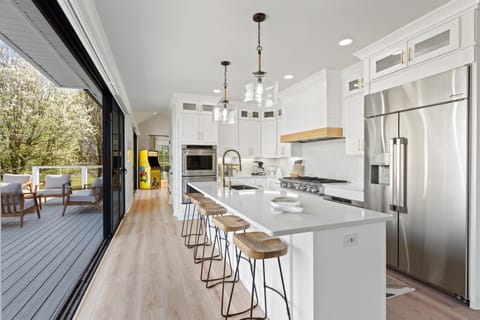 Step into the realm of culinary excellence as you enter our chef's kitchen, meticulously designed to inspire and empower culinary creativity. This extraordinary space is a haven for gastronomic enthusiasts, boasting top-of-the-line appliances.