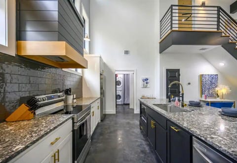 Gather in our sleek kitchen where cooking and socializing come together beautifully.