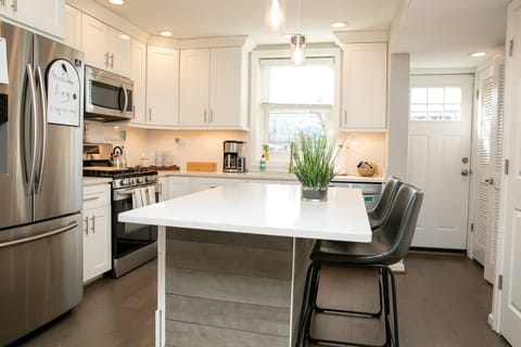 A bright kitchen and outdoor patio greet you. Brew up some coffee or steep some tea and settle in for a relaxing morning planning your day in Alexandria!