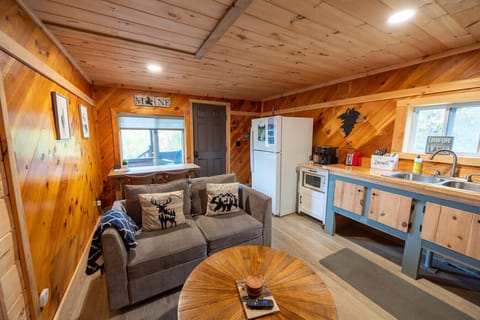 Custom woodwork and cozy cabin details make this kitchen the heart of the home