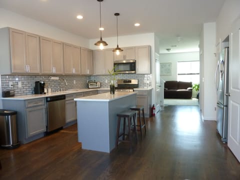 Open concept kitchen with filtered water, toaster oven, Keurig, Kcups, icemaker