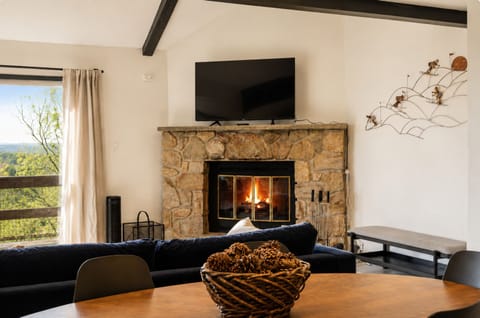 Spacious living room with cozy seating for relaxing and gathering.
