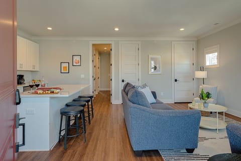 Bright and open living space with smart TV. -Unit 1-