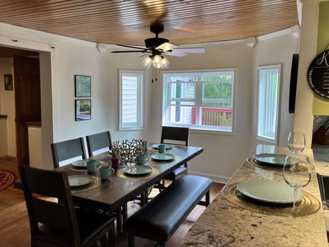 Six to seven can dine easily in this dining room with lots of windows.