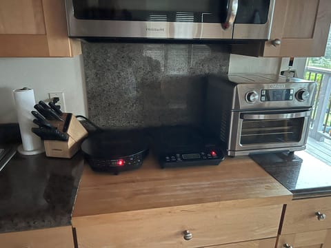 Two induction countertop stoves. Very efficient.