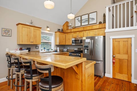 Gorgeous and modern kitchen, including stainless-steel appliances and plenty of cooking equipment.
