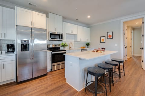 1st Unit: Fully Equipped Kitchen stocked with basic cooking essentials and stainless-steel appliances.
