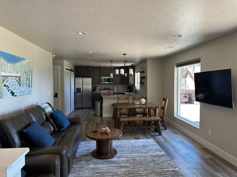 After walking up the stairs you see the living room, dining and kitchen.