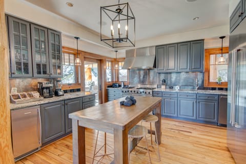 The Rock Gourmet Kitchen With Viking Stainless Appliance and Large Wood Island