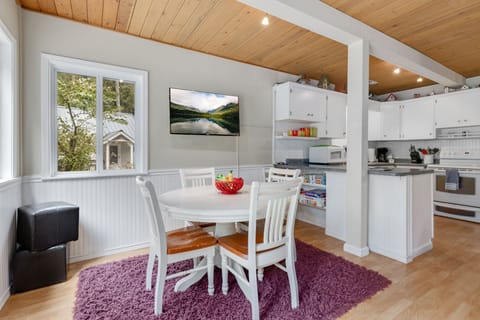 Dining for 4 in a cute breakfast nook between the living room and kitchen