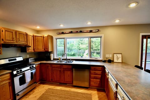 Kitchen with dishwasher and gas range