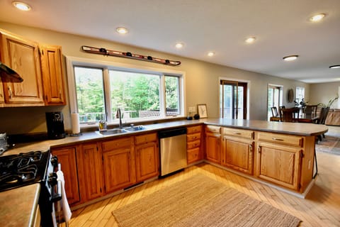 Kitchen with dishwasher and gas range