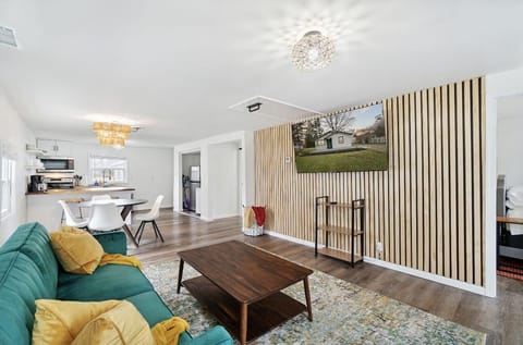 Living room has a 65" Roku smart tv