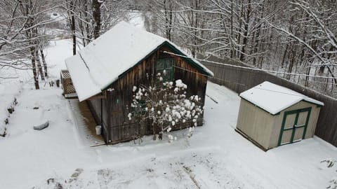 Aerial view of Pond View Cabin and shed in winter conditions.