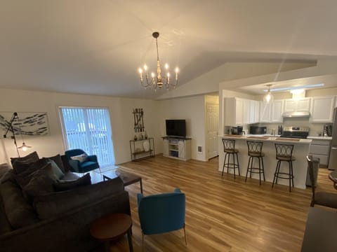 View of living room , kitchen, and dining area from entryway. 