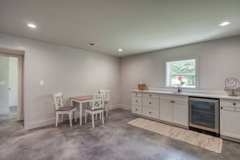 Access to the patio, mini fridge, kitchen essentials, mini dining set, coffee maker with essential coffee pods, and direct lake access.