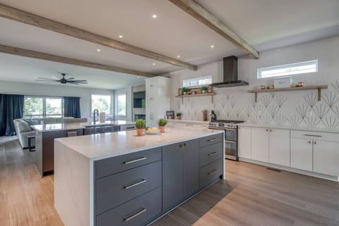 This fully equipped kitchen includes stainless steel appliances, an oven, stove, microwave, dishwasher, fridge, freezer, and a coffee maker with a starter supply of pods. You’ll also find cooking and baking basics, a toaster, blender, BBQ utensils, wine glasses, outdoor plates, a full dining set, and even Alexa for music—all complemented by high-speed WiFi to keep you connected.