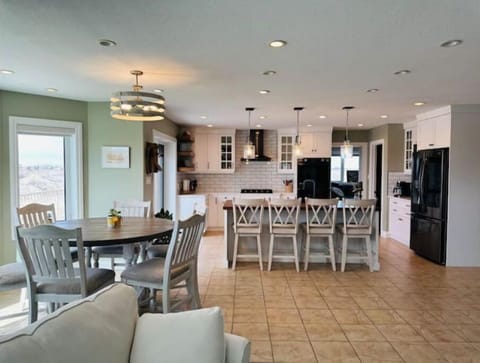 Dining room table can seat 6; kitchen island can seat 4.