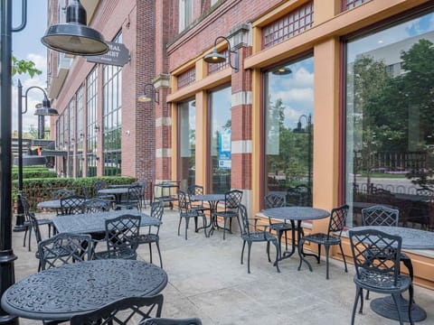 Sip coffee outdoors on the sunlit patio terrace.