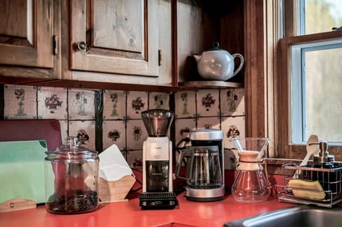 Burr grinder, drip machine, gooseneck kettle, and Chemex for perfect coffee.