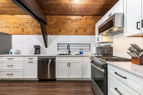 The kitchen features stainless steel appliances and spacious counter space making meal prep a breeze.