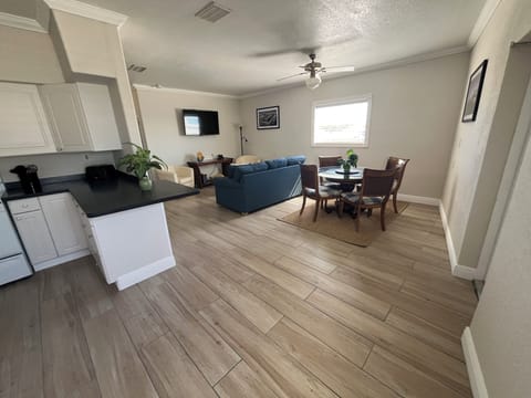 Living, dining and kitchen areas.