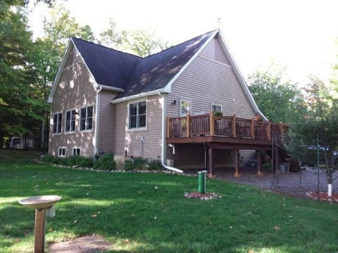 A deck with a Weber Gas Grill to cook a delicious meal with an amazing lake view