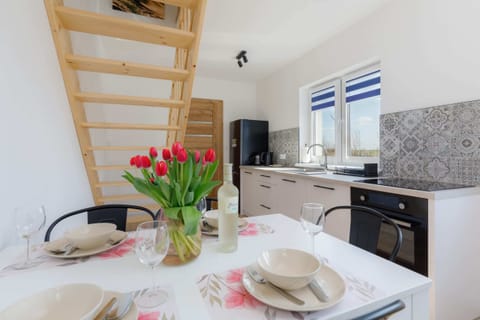 A stylish dining table in the kitchen, set in a bright and inviting space for enjoying meals.