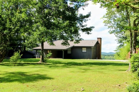 Streetview of the home set off the road for allowing additional privacy and featuring large front yard