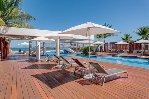 Lounge by the pool under the shade of umbrellas and enjoy a refreshing Caribbean breeze.
