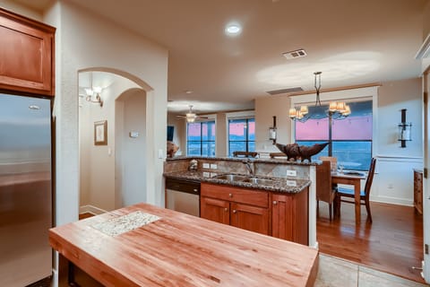 Kitchen looks out to dining area and living space