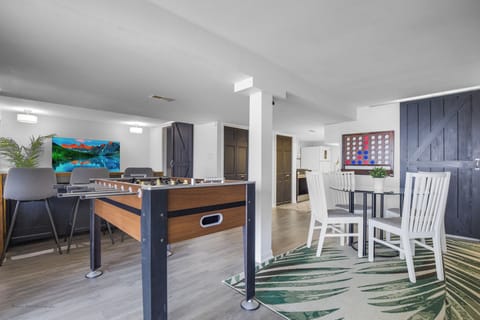 Game room w/ foosball table, Connect 4, giant wall Scrabble, game table, TV area