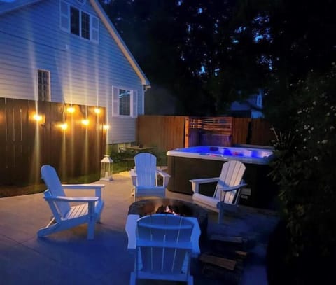 Private patio with new hot tub, fire pit, dining, BBQ, lawn, flower garden, etc