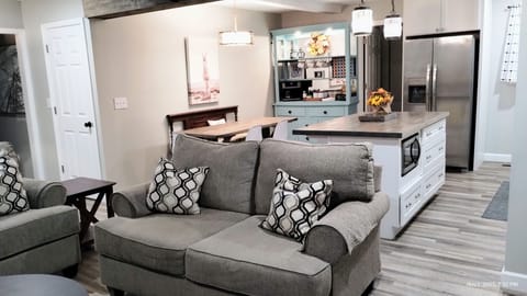 living room view to kitchen, laundry/mudroom & dining area