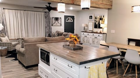 kitchen view to front entrance. Island seats 3. Lots & pans drawers & microwave 