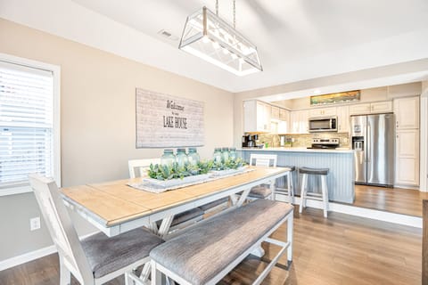 Main dining area offers bar height seating with bench option