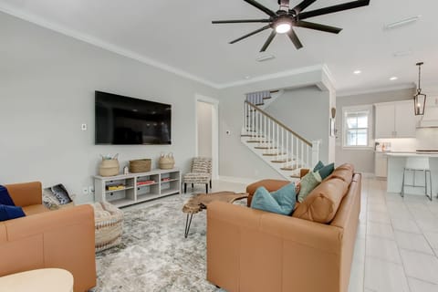 Kitchen located behind, as well as hallway for primary bedroom and stairwell. 
