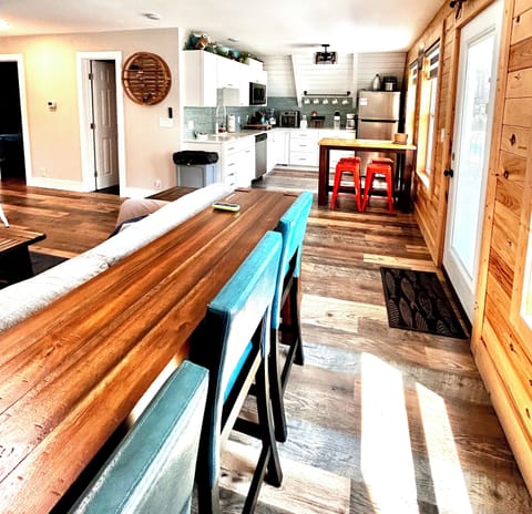 Kitchen and living area with plenty of sit down eating.