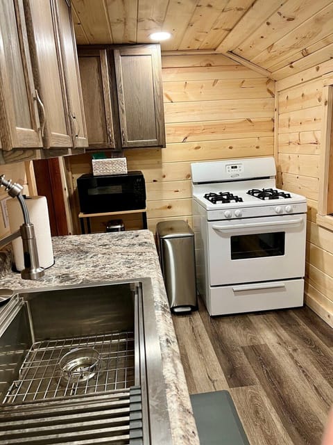 Kitchen with stove/microwave.