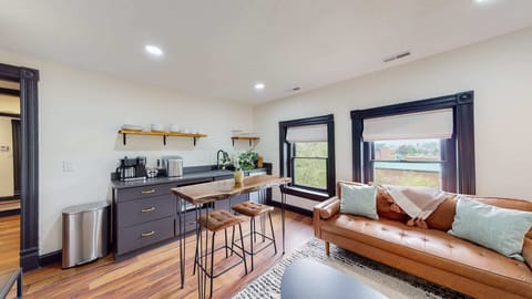 Living Room: Welcome to the top floor of our apartment! The room is really spacious and features an open layout with no walls separating the kitchen, living room, and dining area.