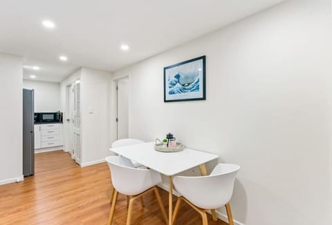 The dining space is in between the lounge and the kitchen.