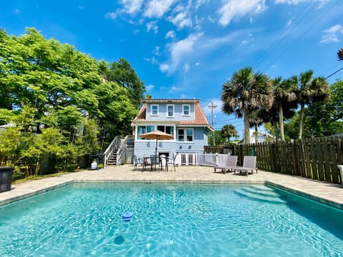 View of private courtyard, pool and main cottage