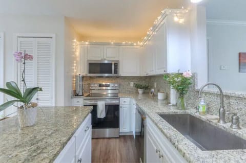 You'll appreciate the new stainless steel Smart Appliances in the kitchen.