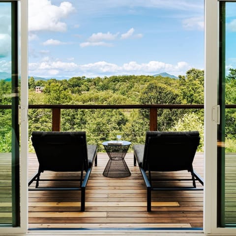 Stretch out and soak up the mountain sun on the deck’s comfy loungers, relax with a book, a drink, or just the view.