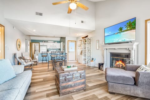 Open living area with natural lighting - Fireplace is for display only