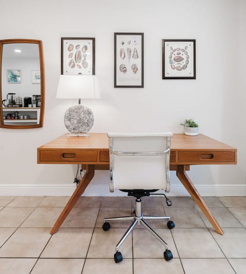 Designated work area with desk and chair.